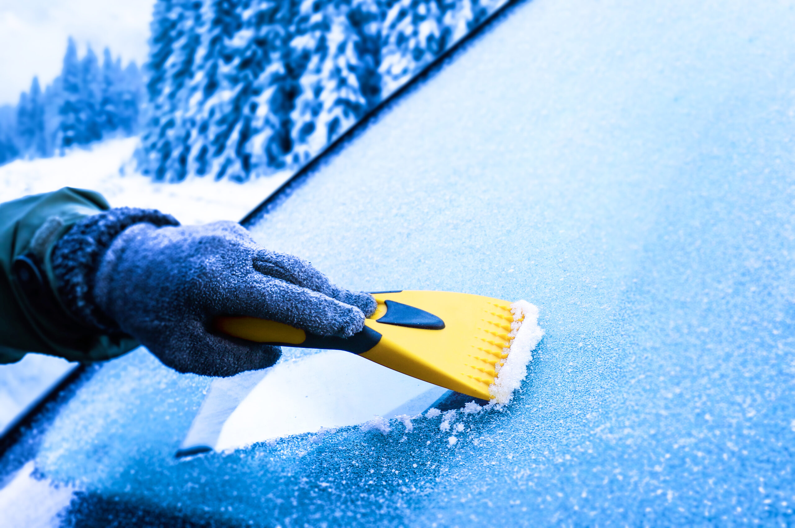 car with frozen windscreen been scraped clear